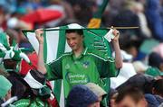 12 August 2007; A Limerick supporter uses his flag as shelter during a shower. Guinness All-Ireland Senior Hurling Championship Semi-Final, Limerick v Waterford, Croke Park, Dublin. Picture credit; Ray McManus / SPORTSFILE