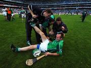 12 August 2007; Sean O'Connor is attended to by the Limerick physio Barry Heffernan as team-mates celebrate. Guinness All-Ireland Senior Hurling Championship Semi-Final, Limerick v Waterford, Croke Park, Dublin. Picture credit; Ray McManus / SPORTSFILE