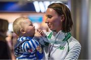 15 December 2014; Team Ireland's Siobhan O'Doherty with her 8 month old nephew Ronan Hegarty, from Nenagh, Co. Tipperary, in Dublin Airport on their return home from the Spar European Cross Country Championships in Bulgaria. Terminal 1, Dublin Airport, Dublin. Picture credit: Brendan Moran / SPORTSFILE
