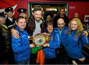 17 December 2014; WBO Middleweight Champion Andy Lee with Ken Moore, Anna Moore, Finbarr O'Brien and Karen Foley from St Francis Boxing Club Limerick, on his return from the USA after defeating Russian Matt Korborov. Shannon Airport, Co Clare. Picture credit: Diarmuid Greene / SPORTSFILE