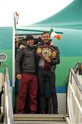 17 December 2014; WBO Middleweight Champion Andy Lee steps off the plane with his trainer Adam Booth, on his return from the USA after defeating Russian Matt Korborov. Shannon Airport, Co Clare. Picture credit: Diarmuid Greene / SPORTSFILE