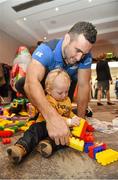 17 December 2014; Leinster Rugby players Dave Kearney, Cian Healy and Jack Conan surprised 30 children from three wonderful charities at a Christmas party at the Conrad Dublin Hotel today.  Conrad Dublin, official hotel to Leinster Rugby, arranged for youngsters from LauraLynn, Heart Children Ireland and Blackrock Flyers Special Olympics Club to meet their sporting heroes, with Santa Claus flying in for the party with gifts for everyone. Pictured are Leinster's Dave Kearney and Finn Delaney aged 17 months from Skerries, Co.Dublin. Conrad Dublin Hotel, Earlsfort Terrace, Dublin. Picture credit: Barry Cregg / SPORTSFILE