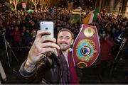 17 December 2014; WBO Middleweight Champion Andy Lee takes a selfie as he is introduced to the crowd in Limerick on his return from the USA after defeating Russian Matt Korborov. Limerick City Hall, Merchant's Quay, Limerick. Picture credit: Diarmuid Greene / SPORTSFILE
