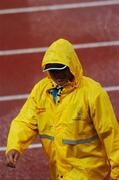 12 August 2007; An official leaves the track during a break in events due to heavy rainfall. Ireland have a team of 68 Athletes competing at the games, with the highlights so far a Silver medal won by Eileen O'Keeffe, from Callan, Co. Kilkenny, in the Hammer Event, and Noel King's Ladies Soccer team to play in the quarter-finals. 2007 is Ireland's 11th representation at the games with former medal winners including Sonia O'Sullivan and Derval O'Rourke. World University Games 2007, Main Stadium, Thammasat University, Bangkok, Thailand. Picture credit: Brian Lawless / SPORTSFILE