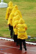 12 August 2007; Officials return to the track after a break in the days events due to a heavy shower. Ireland have a team of 68 Athletes competing at the games, with the highlights so far a Silver medal won by Eileen O'Keeffe, from Callan, Co. Kilkenny, in the Hammer Event, and Noel King's Ladies Soccer team to play in the quarter-finals. 2007 is Ireland's 11th representation at the games with former medal winners including Sonia O'Sullivan and Derval O'Rourke. World University Games 2007, Main Stadium, Thammasat University, Bangkok, Thailand. Picture credit: Brian Lawless / SPORTSFILE