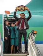 17 December 2014; WBO Middleweight World Champion Andy Lee steps off the plane at Shannon Airport on his return from the USA after defeating Russia's Matt Korborov. Shannon Airport, Co. Clare. Picture credit: Diarmuid Greene / SPORTSFILE