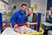 18 December 2014; Leinster's Rob Kearney with 1 month old Annabelle Kinsella, Swords, Co. Dublin, and mother Jennifer during a visit to Temple Street Children's Hospital. Members of the Leinster Rugby Team visited the patients in Temple Street this afternoon to spread some Christmas cheer. Temple Street Children's Hospital, Dublin. Picture credit: Matt Browne / SPORTSFILE