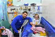 18 December 2014; Leinster's Rob Kearney with 1 year old Maisie Hardiman, Finglas, Dublin, during a visit to Temple Street Children's Hospital. Members of the Leinster Rugby Team visited the patients in Temple Street this afternoon to spread some Christmas cheer. Temple Street Children's Hospital, Dublin. Picture credit: Matt Browne / SPORTSFILE