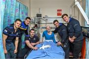 18 December 2014; Leinster players, from left, Sam Coghlan Murray, Noel Reid, Cian Healy, Fergus McFadden and Brendan Macken, with 14 year old Lucy Waters, Blackrock, Co. Dublin, during a visit to Temple Street Children's Hospital. Members of the Leinster Rugby Team visited the patients in Temple Street this afternoon to spread some Christmas cheer. Temple Street Children's Hospital, Dublin. Picture credit: Matt Browne / SPORTSFILE