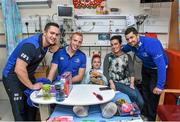 18 December 2014; Leinster players, from left, Colm O'Shea, Darragh Fanning and Rob Kearney, with 8 year old Anna Butler, Roscam, Co. Galway,  and her mother Niamh during a visit to Temple Street Children's Hospital. Members of the Leinster Rugby Team visited the patients in Temple Street this afternoon to spread some Christmas cheer. Temple Street Children's Hospital, Dublin. Picture credit: Matt Browne / SPORTSFILE
