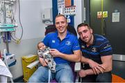 18 December 2014; Leinster's Darragh Fanning and Jack Conan with 1 month old Cillian O'Hara, Trim, Co. Meath, during a visit to Temple Street Children's Hospital. Members of the Leinster Rugby Team visited the patients in Temple Street this afternoon to spread some Christmas cheer. Temple Street Children's Hospital, Dublin. Picture credit: Matt Browne / SPORTSFILE