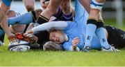 20 December 2014; Sam Coghlan-Murray, UCD, feeds possession to a team-mate after being tackled. Ulster Bank League Division 1A, Terenure v UCD. Lakelands Park, Terenure, Dublin. Picture credit: Piaras Ó Mídheach / SPORTSFILE