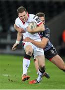 20 December 2014; Darren Cave, Ulster, is tackled by Ashley Beck, Ospreys. Guinness PRO12, Round 10, Ospreys v Ulster, Liberty Stadium, Swansea, Wales. Picture credit: Steve Pope / SPORTSFILE