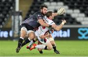 20 December 2014; Darren Cave, Ulster, is tackled by Scott Baldwin, Ospreys. Guinness PRO12, Round 10, Ospreys v Ulster, Liberty Stadium, Swansea, Wales. Picture credit: Steve Pope / SPORTSFILE