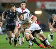 20 December 2014; Sean Reidy, Ulster, is tackled by James King, Ospreys. Guinness PRO12, Round 10, Ospreys v Ulster, Liberty Stadium, Swansea, Wales. Picture credit: Steve Pope / SPORTSFILE