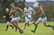 21 December 2014; Benny Hickey, Cahir, in action against John Ryan, left, and Willie Eviston, Loughmore-Castleiney. Tipperary Senior Football Championship Final, Loughmore-Castleiney v Cahir, Leahy Park, Cashel, Co. Tipperary. Picture credit: Matt Browne / SPORTSFILE
