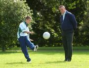 15 August 2007; Dublin manager Paul Caffrey watches his son Ericin in action at the launch of the MBNA Kick Fada 2007. The MBNA Kick Fada competition, tests the abilities of the countries best footballers to kick for distance and accuracy. Over 20 stars of Gaelic Football will compete for the prestigious All-Ireland title at the 8th annual MBNA Kick Fada competition, which will take place on Saturday, September 8th at Bray Emmets GAA Club, Bray, Co. Wicklow. Herbert Park Hotel, Ballsbridge, Dublin. Picture credit: Pat Murphy / SPORTSFILE