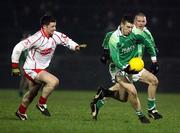 10 February 2007; Barry Owens, Fermanagh, in action against Enda McGinley, Tyrone. Allianz National Football League, Division 1A, Round 2, Tyrone v Fermanagh, Healy Park, Omagh, Co. Tyrone. Picture Credit: Oliver McVeigh / SPORTSFILE