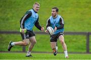 22 December 2014; Munster's JJ Hanrahan, supported by team-mate John Ryan, in action during squad training ahead of their Guinness PRO12, Round 11, match against Leinster on Friday. Munster Rugby Squad Squad Training, University of Limerick, Limerick Picture credit: Diarmuid Greene / SPORTSFILE