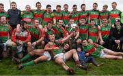 26 December 2014; The Loughmore-Castleiney captain David Kennedy with the victorious team during the team photograph after the presentation. Tipperary Senior Football Championship Final Replay, Loughmore-Castleiney v Cahir, Leahy Park, Cashel, Co. Tipperary. Picture credit: Ray McManus / SPORTSFILE