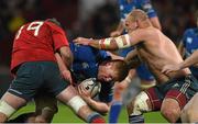 26 December 2014;  Tom Denton, Leinster, is tackled by Dave O'Callaghan, left, and a shirtless BJ Botha, Munster. Guinness PRO12, Round 11, Munster v Leinster, Thomond Park, Limerick. Picture credit: Diarmuid Greene / SPORTSFILE