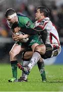 26 December 2014; Jack Carty, Connacht, is tackled by Louis Ludik, Ulster. Guinness PRO12, Round 11, Ulster v Connacht, Kingspan Stadium, Ravenhill Park, Belfast, Co. Down. Picture credit: Ramsey Cardy / SPORTSFILE