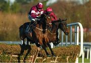 28 December 2014; Identity Thief, with Bryan Cooper up, clears the last ahead of second placed Snow Falcon, with Paul Carberry up, right, on their way to winning the At Races Maiden Hurdle. Leopardstown Christmas Festival, Leopardstown, Co. Dublin. Picture credit: Pat Murphy / SPORTSFILE