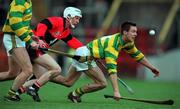 31 October 1999; Alan Cummins of Blackrock gathers possession ahead of Johnny Enright of UCC during the Cork County Senior Club Hurling Championship Final match between Blackrock and UCC at Páirc Uí Chaoimh in Cork. Photo by Brendan Moran/Sportsfile