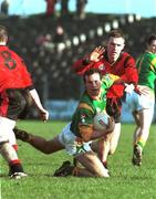 13 February 2000; Anthony Moyles of Meath holds off the challenge of Paul McGrath of Down during the Church & General National Football League Division 1B Round 4 match between Meath and Down at Páirc Tailteann in Navan, Meath. Photo by Sportsfile
