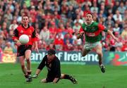 26 September 1999; Barry Loftus of Mayo in mid air as Down goalkeeper John Sloan looks on during the All-Ireland Minor Football Championship Finall match between Down and Mayo at Croke Park in Dublin. Photo by Matt Browne/Sportsfile