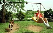 9 April 1999; Team captain Barry Quinn enjoy himself on the swings at the Institute of Tropical Agriculture after a Republic of Ireland U20 Squad training sesssion at the Liberty Stadium in Ibadan, Nigeria. Photo by David Maher/Sportsfile