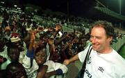 2 April 1999; Manager Brian Kerr greets local school children after a Republic of Ireland U20 Squad training sesssion at the Liberty Stadium in Ibadan, Nigeria. Photo by David Maher/Sportsfile