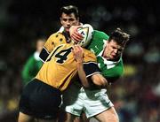 19 June 1999; Brian O'Driscoll of Ireland is tackled by Jason Little of Australia during the Ireland Rugby Tour to Australia Second Test match between Australia and Ireland at the Subiaco Oval in Perth, Australia. Photo by Matt Browne/Sportsfile