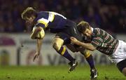 15 January 2000; Brian O'Driscoll of Leinster is tackled by Tim Stimpson of Leicester during the Heineken Cup Pool 1 Round 6 match between Leicester and Leinster at Welford Road in Leicester, England. Photo by Brendan Moran/Sportsfile