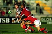 20 November 1999; Ceri Sweeney of Pontypridd in action against Alan Quinlan, 6, and Peter Stringer of Munster during the Heineken Cup Pool 4 Round 1 match between Munster and Pontypridd at Thomond Park in Limerick. Photo by Ray Lohan/Sportsfile