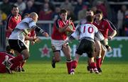 20 November 1999; Cian Mahony of Munster in action against Will James, left, and Ceri Sweeney, 10, of Pontypridd during the Heineken Cup Pool 4 Round 1 match between Munster and Pontypridd at Thomond Park in Limerick. Photo by Brendan Moran/Sportsfile