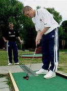 22 July 1999; Colin Healy tests his putting skills on a local crazy golf course, watched by team-mate Richie Patridge, after a Republic of Ireland training session at Karlbergsplan in Linkoping, Sweden. Photo by David Maher/Sportsfile