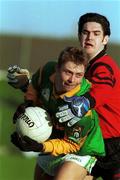 13 February 2000; Cormac Murphy of Meath holds off the challenge of Shane Mulholland of Down during the Church & General National Football League Division 1B Round 4 match between Meath and Down at Páirc Tailteann in Navan, Meath. Photo by Sportsfile