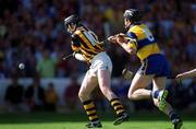 15 August 1999; DJ Carey of Kilkenny shoots to score a goal despite the efforts of Seán McMahon of Clare during the Guinness All-Ireland Senior Hurling Championship Semi-Final match between Clare and Kilkenny at Croke Park in Dublin. Photo by Brendan Moran/Sportsfile