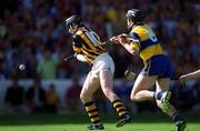 15 August 1999; DJ Carey of Kilkenny shoots to score a goal despite the efforts of Seán McMahon of Clare during the Guinness All-Ireland Senior Hurling Championship Semi-Final match between Clare and Kilkenny at Croke Park in Dublin. Photo by Brendan Moran/Sportsfile