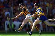 15 August 1999; DJ Carey of Kilkenny shoots to score a goal despite the efforts of Seán McMahon of Clare during the Guinness All-Ireland Senior Hurling Championship Semi-Final match between Clare and Kilkenny at Croke Park in Dublin. Photo by Brendan Moran/Sportsfile