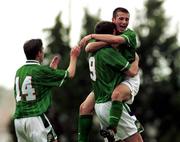 24 November 1999; Ben Burgess of Republic of Ireland, 9, with team-mates Shaun Byrne, left and Liam Miller after scoring the only goal of the game during the UEFA Under-18 Championship Preliminary Round match between Malta and Republic of Ireland at Hibernians Football Ground in Paola, Malta. Photo by David Maher/Sportsfile