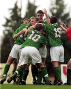 24 November 1999; Ben Burgess of Republic of Ireland, hidden, celebrates with team-mates Shaun Byrne, Liam Miller, Graham Barrett, Thomas Butler and John O'Shea after scoring the only goal of the game during the UEFA Under-18 Championship Preliminary Round match between Malta and Republic of Ireland at Hibernians Football Ground in Paola, Malta. Photo by David Maher/Sportsfile