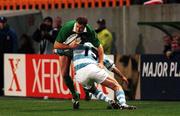 20 October 1999; Matt Mostyn of Ireland is tackled by Ignacio Corletto of Argentina during the 1999 Rugby World Cup Quarter-Final Play-Off match between Argentina and Ireland at Stade Felix Bollaert in Lens, France. Photo by Matt Browne/Sportsfile