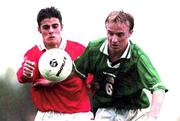 24 November 1999; Thomas Butler of Republic of Ireland in action against Malta's Roderick Briffa of Malta during the UEFA Under-18 Championship Preliminary Round match between Malta and Republic of Ireland at Hibernians Football Ground in Paola, Malta. Photo by David Maher/Sportsfile