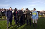1 January 2000; Karl Casey, Director of Waterford and Tramore Racecourse, opens a bottle of champagne with Shea Barry, jockey winner of the first race, The Mean Fiddler Handicap Steeplechase, alongside Vince Power and his partner and Michael Murphy Manager of the Racecourse, far left, at Waterford and Tramore Racecourse in Waterford. Photo by Damien Eagers/Sportsfile