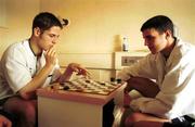 23 November 1999; Republic of Ireland players Graham Barrett, left, and John O'Shea spend some spare time playing a game of draughts at the team hotel, Les Lapins, at the Ta'Xbiex Yacht Marina in Malta. Photo by David Maher/Sportsfile