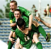 10 April 1999; Richard Sadlier of Republic of Ireland, 14, celebrates scoring his side's first goal with team-mates Robbie Keane, centre, and Barry Quinn during the 1999 FIFA World Youth Championship Group C Round 3 match between Australia and Republic of Ireland at the Liberty Stadium in Ibadan, Nigeria. Photo by David Maher/Sportsfile