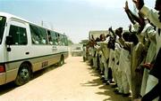 13 April 1999; The Republic of Ireland team bus is cheer on by locals as they leave the team hotel, Tahir Guest Palace, to go to a training session, in Kano, Nigeria. Photo by David Maher/Sportsfile