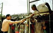 12 April 1999; Manager Brian Kerr shakes hands with local people who attended a Republic of Ireland U20 Squad training sesssion at the Pillas Stadium in Kano, Nigeria. Photo by David Maher/Sportsfile
